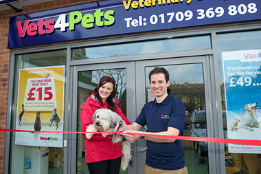 Ashleigh, Pudsey and Eric cutting the ribbon to offically open the doors to Vets4Pets Rotherham