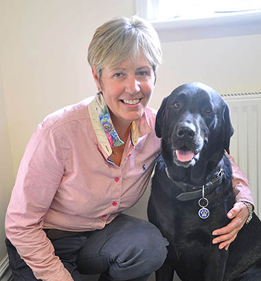 Photo of H Sanderson and her labrador