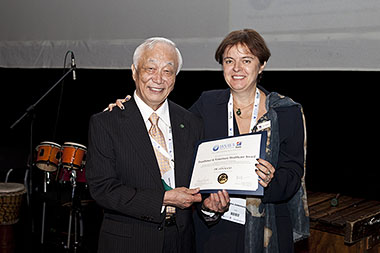 Dr Kato receiving his award