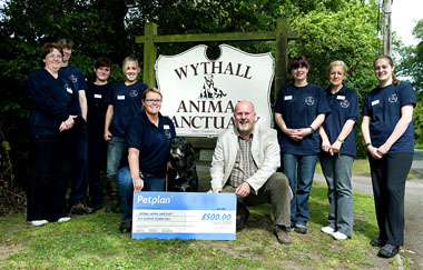 Melvyn Wilkins, Petplan Business Developer, with Wythall Animal Sanctuary staff