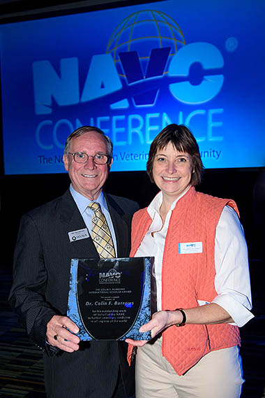 Dr Burrows receiving an award from then NAVC President Dr Charlotte Lacroix to mark the relaunch of the International Scholar Program at the International Delegate Reception at NAVC