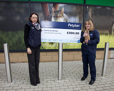 Louise Brocklesby, Petplan Account Executive with Debra Cook, RSPCA East Norfolk Branch Manager and a furry friend