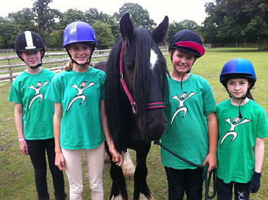 Photo of horse with young riders