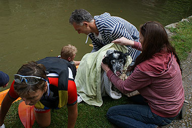 Photo of vets in kayak rescuing dog