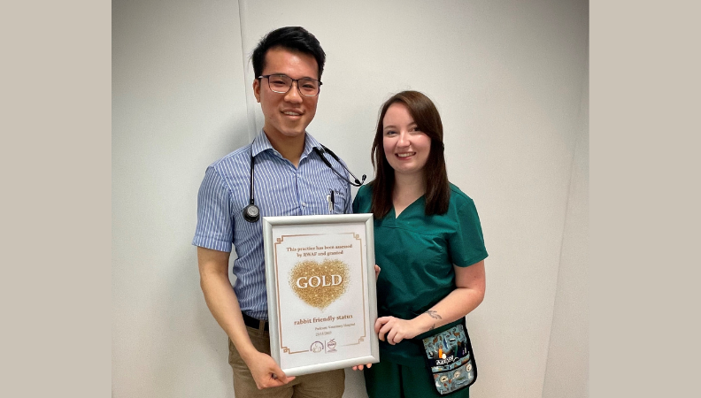Dr Sam Mak (left) and Kiana McCabe RVN (right) holding their certificate from the RWAF.