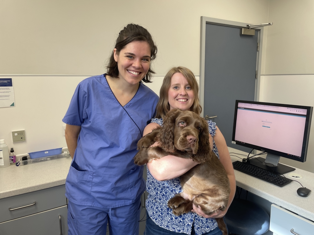 Eleven-week-old Sussex spaniel Elton, who is back on all paws following intensive physiotherapy at Willows Veterinary Centre and Referral Service in Solihull, pictured with owner Philippa and Willows' veterinary physiotherapist Holly Finelli.  
