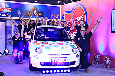 Photo of Hill's staff and winner around car