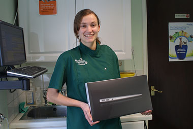 Leanne Hibberd holding her MacBook Air