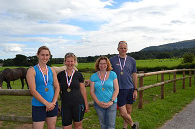 (Left to right) Lottie Hunter SVN winner of the running, Emma Jones MRCVS winner of the cycling, Sian Tranter MRCVS winner of the dressage and Nick 'the fish' Hooton MRCVS winner of the swimming