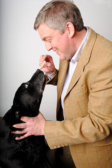 David Babington smiling at a dog