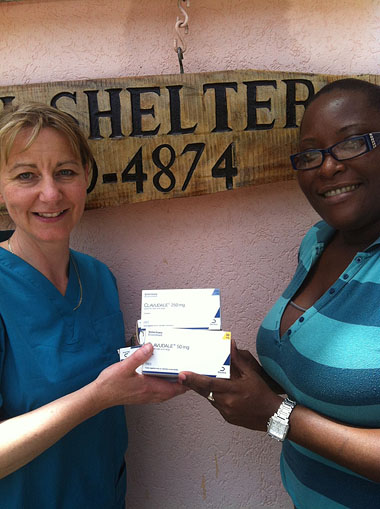 Emma Robinson, with Mersha Phillips, of Grenada SPCA and some of the donated Dechra products