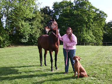 Photo of Gemma and a horse in a field