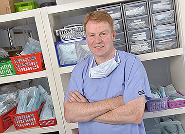 John Innes in a consulting room