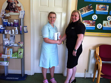 Emily Macvarish (left) receiving her prize from Lintbells’ Rachel Tomlinson-Leyden