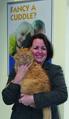 Maggie holding a cat