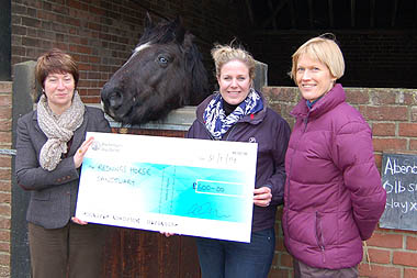 Lynn Cutress, chief executive officer of Redwings (left), and Nicky Jarvis, head of veterinary services at Redwings (right), being presented with a cheque by Clare Turnbull, equine brand and technical manager at Boehringer Ingelheim