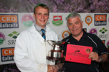 Kyle Campbell being awarded the sought after Stockman of the Year by Graeme Crawford