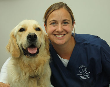 Photo of Helen and smiling labrador