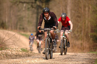 Photo of people mountain biking