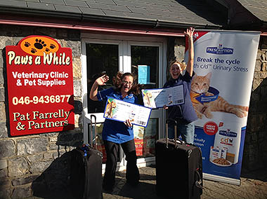 Patricia with her cheque outside the practice