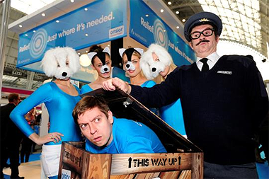 Man in a box and animal performers entertain veterinarians at the London Vet Show