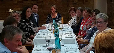 Photo of people at dinner table