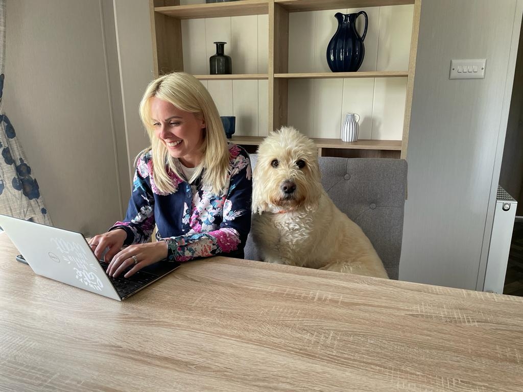 Photo of person walking from home with dog sitting next to them. Credit  iPET Network/ Animal News Agency 