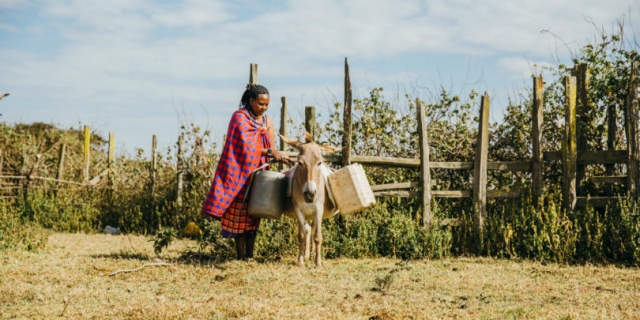 woman and her donkey in Kenya