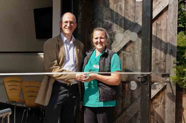 Julie Riches-Tomei, radiography nurse and Clive Elwood managing director of DVS cut the ribbon to open the new staff room