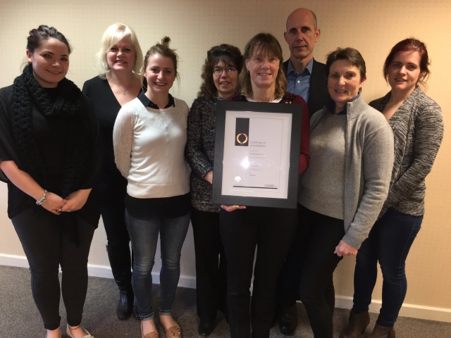 Alison Babington MRCVS (holding the certificate) with other members of the Improve International team