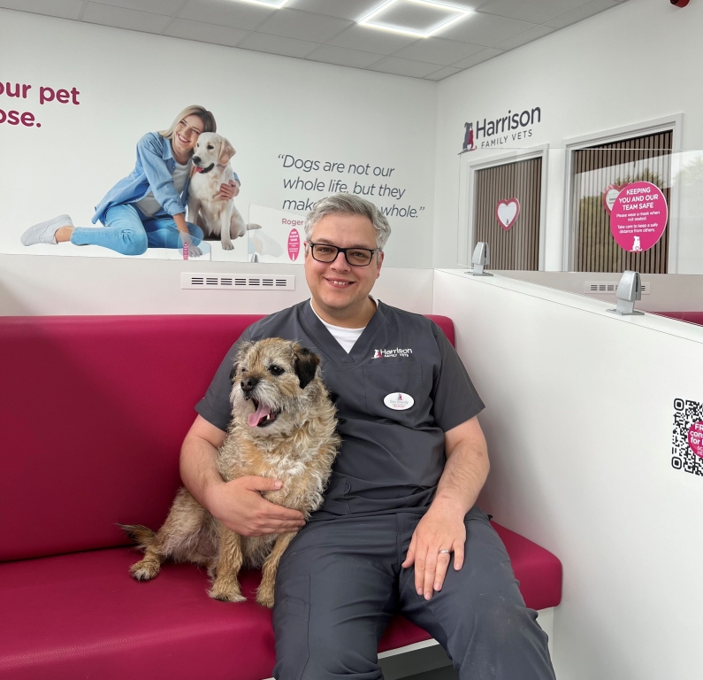 Vet, Dan Grundy, from Harrison Family Vets with his dog Dougal