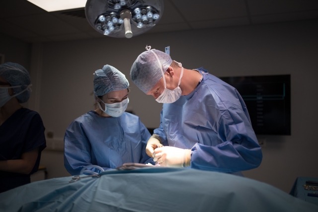 Specialist Surgeon Ben Keeley and Intern Karen Pettit operating on the first surgical case at MVS.
