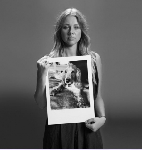 Natasha Ravenscroft with a picture of her dog Baxter who died of Lungworm aged 1 yr