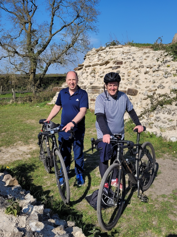 Craig and Lawrance standing holding their bicycles