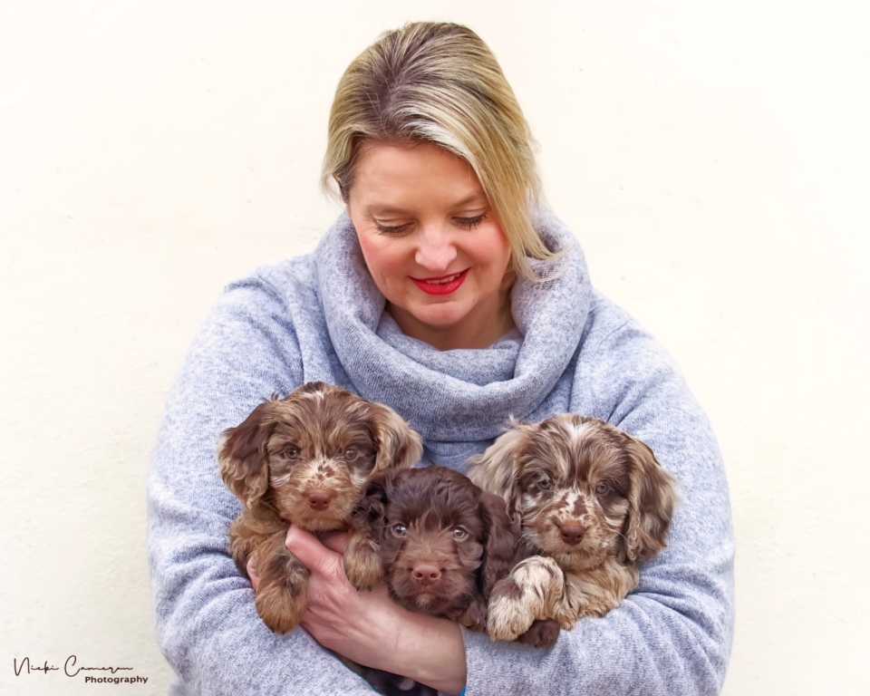 Rebecca holding two dogs