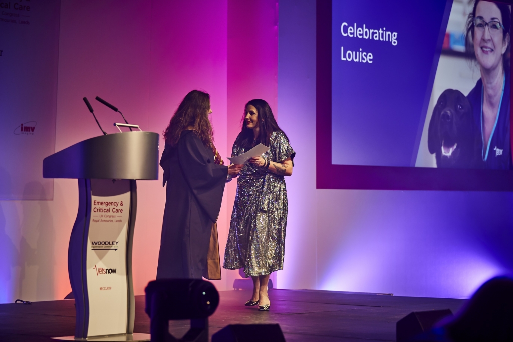 Lesley Moore receiving award from Amanda Boag 