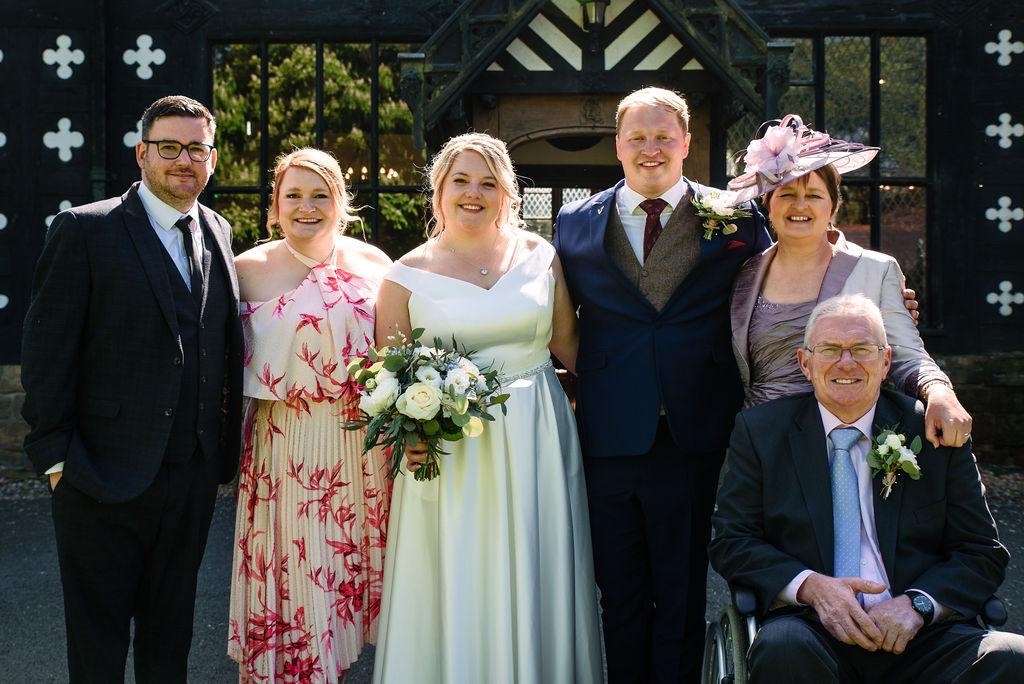 Emma Dever with her father John and family at her brother’s wedding earlier this year. 