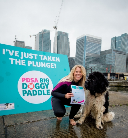 Diets Business Manager for Dechra Veterinary Products, Rhian Westcott, pictured with one of the five trained Newfoundland rescue dogs.