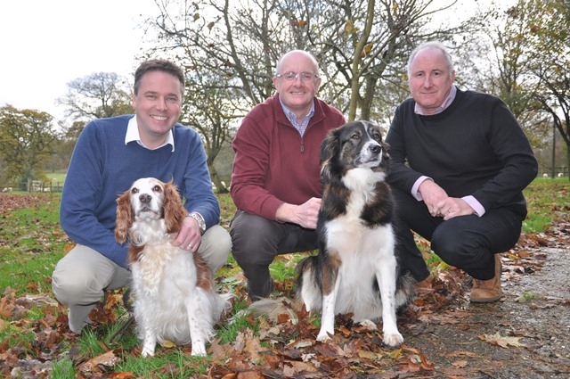  (left to right): Cofounders John Howie  John Davies with Operations Director Nigel Pittman accompanied by Welsh Springer Spaniel Pippa and Moroccan Mountain Dog Jasmine.