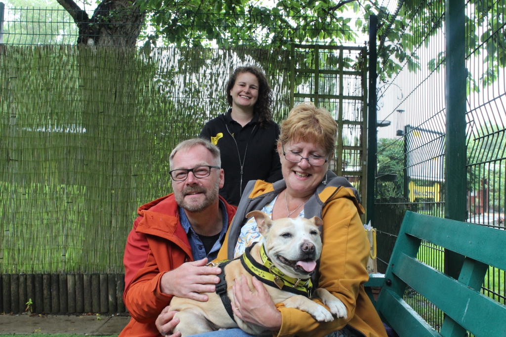 Lola is pictured with Susie and Roger along with fostering co-ordinator Kim Rowlands