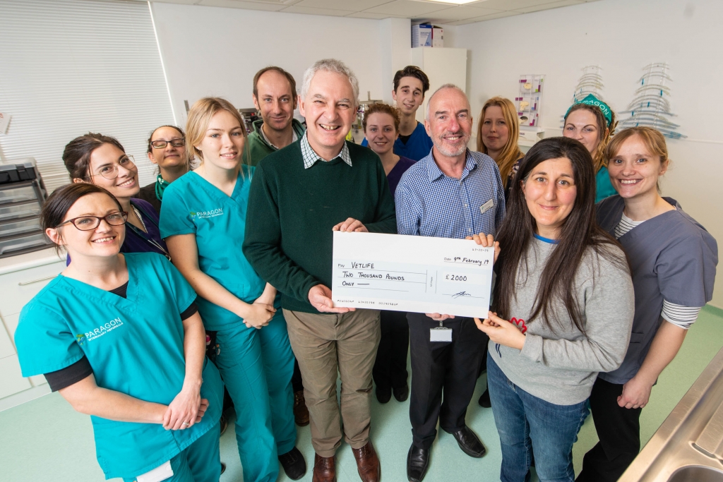 Clinical director Sophie Adamantos (right) and managing director Ian Monteith (centre) hand over a 2,000 cheque to Richard Kellen from Vetlife