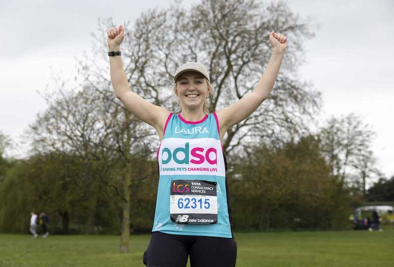 Laura Scowen arms aloft after completing the London Marathon