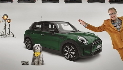 Film set with a green mini, dog and Alan Carr