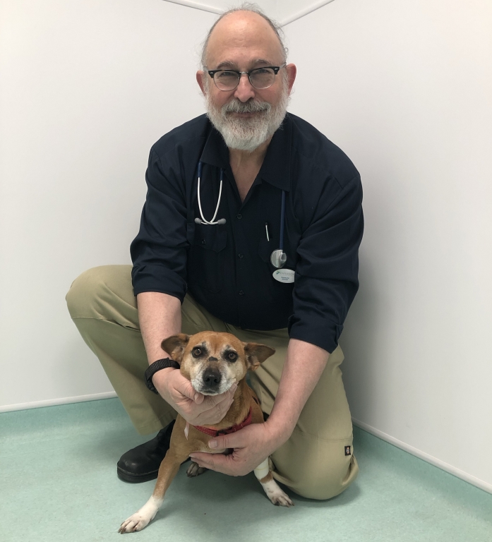 Oncology specialist Dr Rodney Ayl with Evie