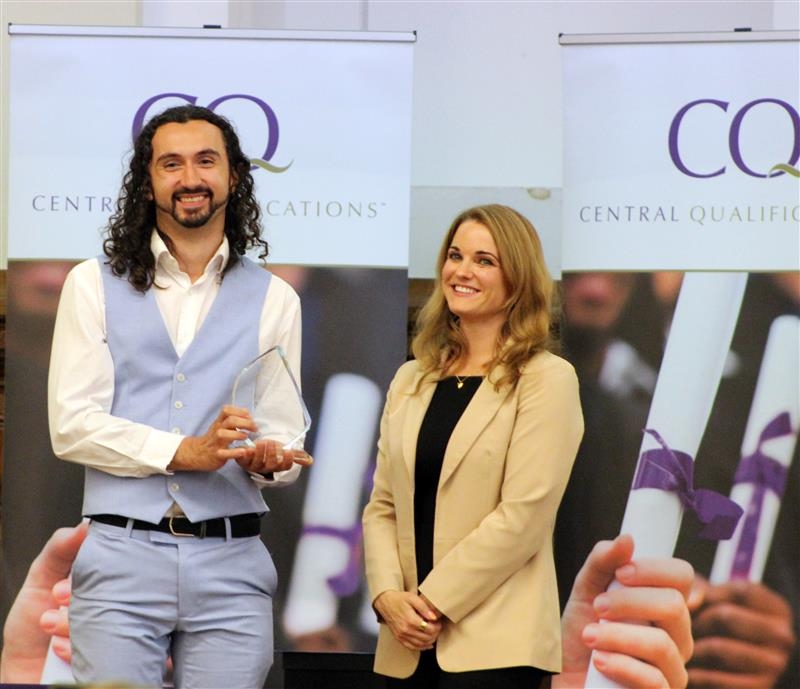 Matt Badham, winner of the Veterinary Nurse Educator of the Year Award 2025, accepting his award from naturalist and writer Cat Capon