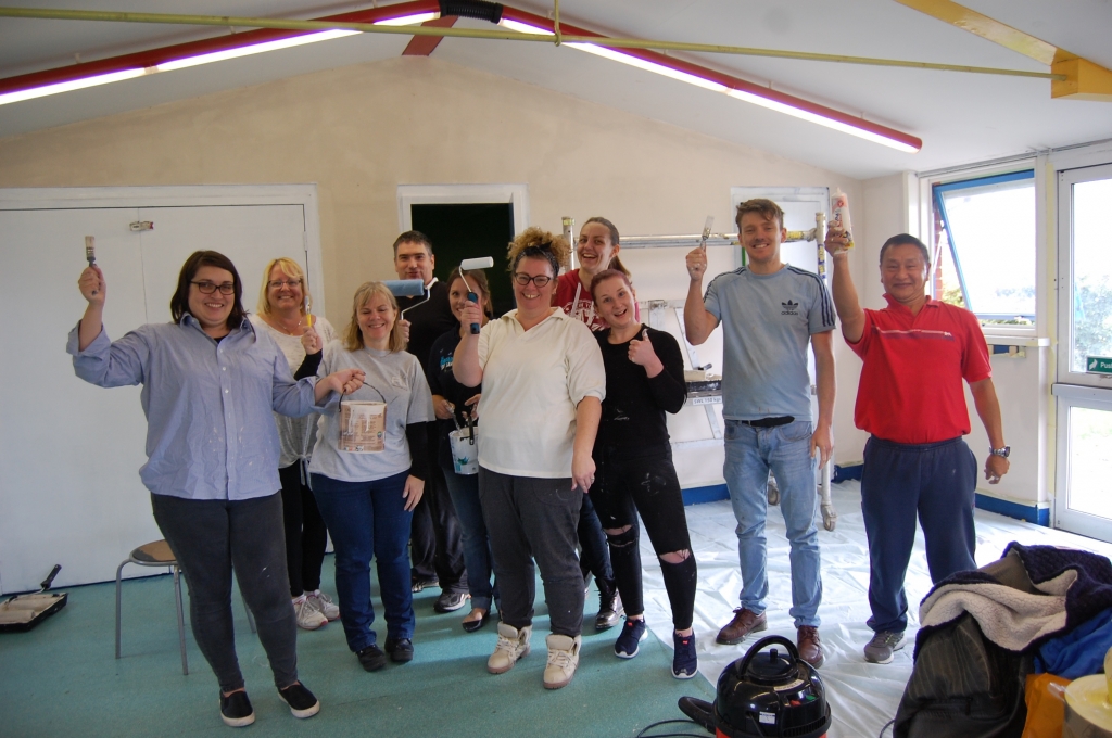 Vets4Pets colleagues painting Buckhurst Park Communtiy Centre's classroom