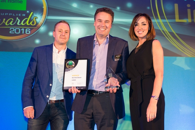John Howie (centre), co-founder of Lintbells receives the companys award from Chris Holyland, Ecommerce Director at Pets at Home and TV presenter      Sally Nugent.