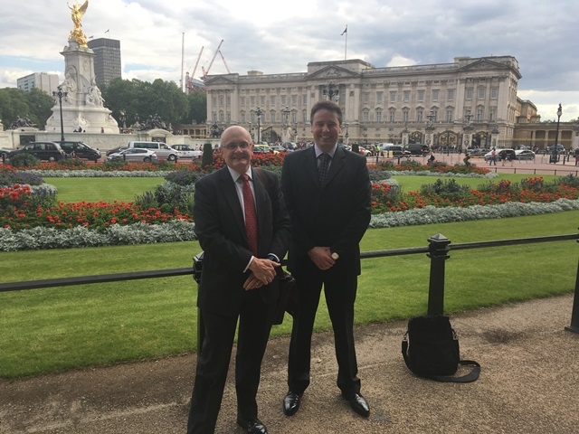 Photo caption: (left to right): Cofounders John Davies  John Howie outside Buckingham Palace