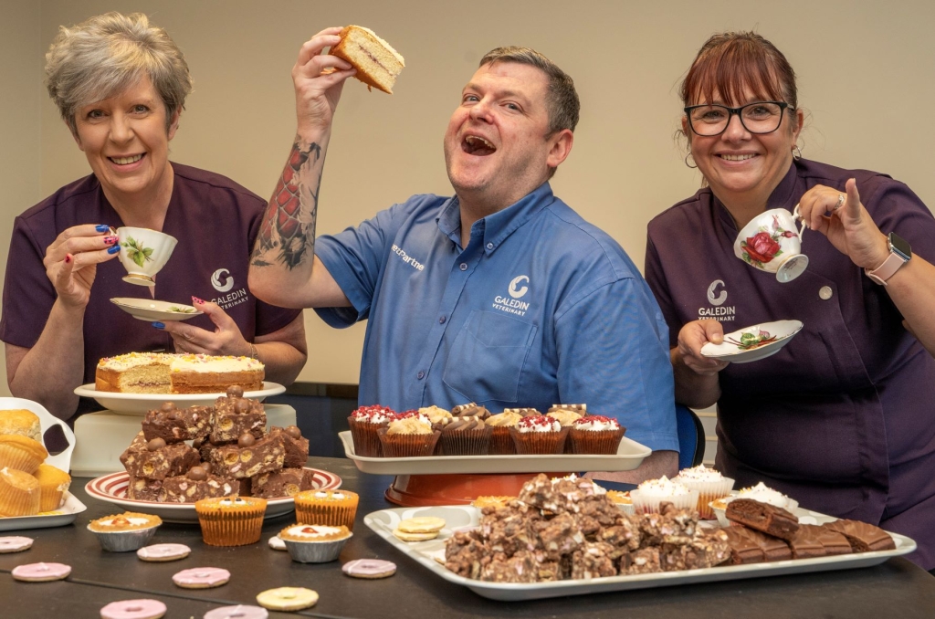Galedin Vets deputy practice manager Chris Richardson enjoying a slice of cake with Galedin bakers and reception team members, Gillian McLachlan, left, and Angela Brown