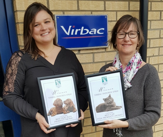 Kate Woolley (left), Product Manager at Virbac, being presented with the Awards by Sarah Wright, Editor in Chief of Your Dog and Your Cat Magazines.